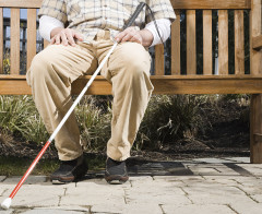 Blind man sitting on a bench